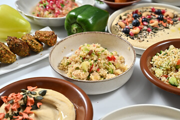 a variety of food dishes are laid out on a table