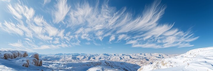 Obraz premium Majestic Winter Wonderland - Stunning Panoramic View of Snowy Mountain Range under Clear Skies | Ultra-Detailed Landscape Photo