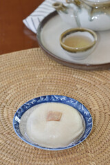 Steamed buns on a woven tray, Chinese dessert restaurant