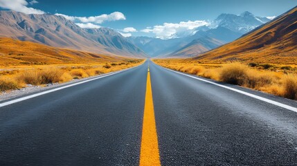 Fototapeta premium A desolate winding road stretches through a vast arid landscape under a clear blue sky in summer