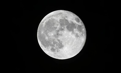 Near full moon with dark blue background at night. Horizontal photograph. Madrid, Spain, Europe