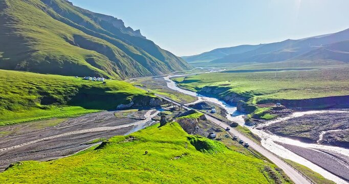 Aerial view of the famous Duku Highway and river with mountain natural landscape in Xinjiang. Duku Highway is the most beautiful highway in China.
