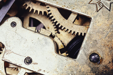 Complex gears showcase engineering in aged watch mechanism