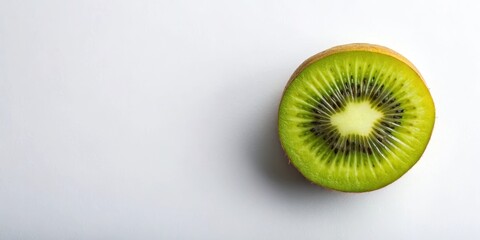 A Perfectly Sliced Kiwi Fruit with Visible Seeds and a Light Green Center Against a White Background