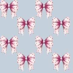 Decorative pink and white bows with polka dots on a soft blue background