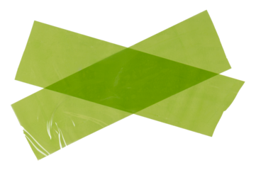 Isolated green cross made from torn strip of repair tape with copy space on white background