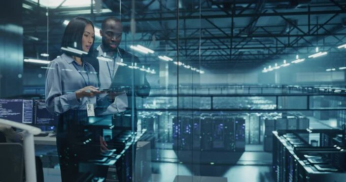 In a Modern Data Center, Black Male Data Scientist and Asian Female AI Specialist Analyze Algorithms on a Laptop. Specialists Exploring Optimizations for Processing Large Datasets - Powered by Adobe