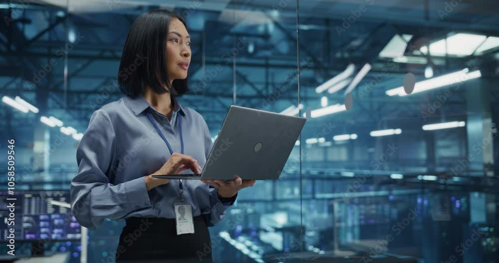 Poster Positive Female Infrastructure Architect Reviewing Virtualization Strategies on a Laptop Computer, Standing in Office Next to Towering Racks of Servers, Planning to Scale Client Cloud Solutions