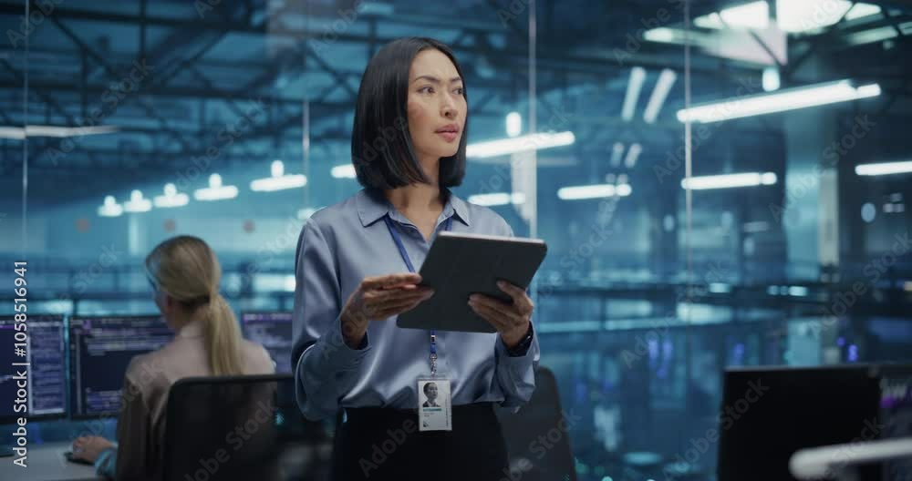 Poster Beautiful Asian Female Cybersecurity Expert Works on Her Tablet Computer in a Modern Facility, Running Diagnostic Tests to Identify Network Vulnerabilities in a Data Center with Server Racks