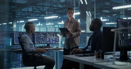 Gathered for a Briefing, Three Diverse Team Members, Two Men and a Female Team Leader Reviewing Project Requirements and Commercial Opportunities in the High-Tech Data Center Office - Powered by Adobe