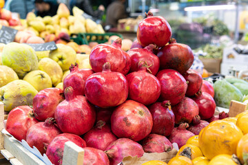 organic pomegranate closeup vegetarian red ripe juicy background food market healthy fruit fresh