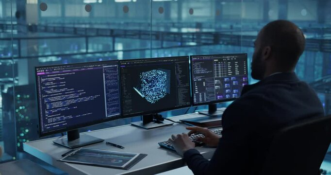 With Multiple Screens Open to Code and Analyze Neural Network Visualizations, African Software Developer in a Data Center Refines an AI Algorithm, Working Methodically to Improve the Product