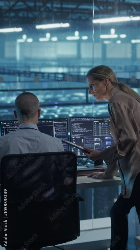 Poster Vertical Screen: Team of Developers Working on Computers in a Modern Office in a Data Center Facility. Team Analyzing Data and Optimizing Systems. Female Manager Having a Conversation with a Colleague