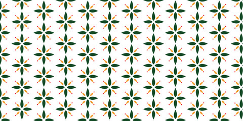 Cool pattern with simple floral motif in green and orange on a white background
