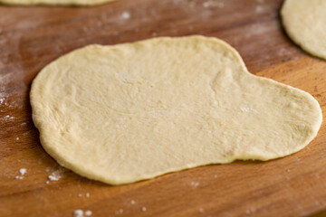 Wheaten Pita Flat Bread. Baking Bread. Raw pita. Food concept