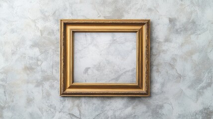 Elegant gold frame against a textured wall, perfect for displaying art or photographs in a stylish setting.