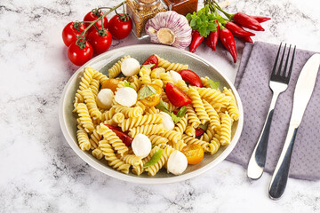Italian pasta with mozzarella and tomato