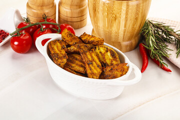 Golden baked potato Idaho with spices