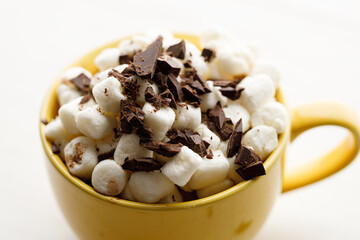Cocoa and marshmallows in yellow ceramic cup