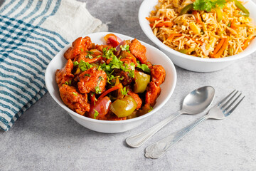 Chilli chicken is a spicy Indo-Chinese dish featuring crispy fried chicken tossed in a tangy, savory sauce with peppers and onions.