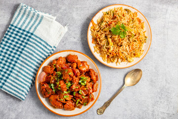 Chilli chicken is a spicy Indo-Chinese dish featuring crispy fried chicken tossed in a tangy, savory sauce with peppers and onions.