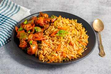 Chilli chicken is a spicy Indo-Chinese dish featuring crispy fried chicken tossed in a tangy, savory sauce with peppers and onions.