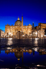 Panoramic night view of St Peter's Basilica with beautiful reflection in Vatican City....