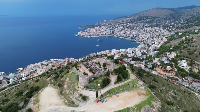 Lekuresi castle ruin, aerial drone Saranda Albania city view Ionian Sea