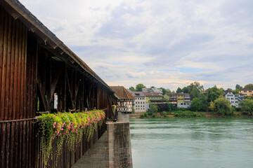 Fototapeta premium The historic old wooden bridge between Germany and Switzerland over the Rhine at Bad Säckingen