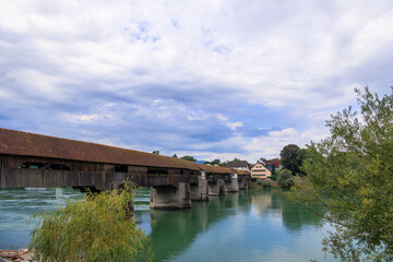 Fototapeta premium The historic old wooden bridge between Germany and Switzerland over the Rhine at Bad Säckingen