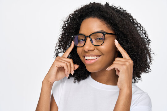 Happy smiling young adult African American woman wearing luxury modern stylish eyeglasses looking at camera advertising glasses or optics store isolated on white background. Close up photo