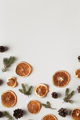 Natural organic composition with dried oranges, cones and fir twigs. Holidays concept, natural background.