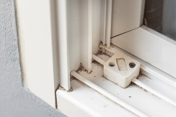 Dust on window sills and tracks corner,  these areas need cleaning.