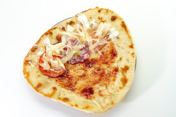 Preparation of traditional pita. A man lays out souce, meat on pita. pita. Food concept