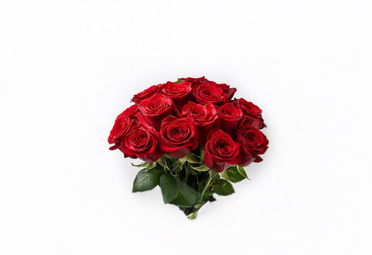 A bouquet of red roses, tightly bundled, arranged in a circular shape.  The roses are in full bloom with a white background.