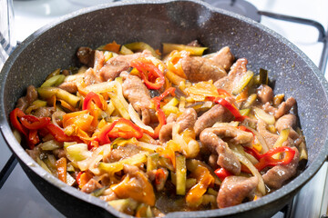 Beef with vegetables in soy sauce. onion, carrot, bell pepper. Food concept. Chinese food