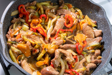 Beef with vegetables in soy sauce. onion, carrot, bell pepper. Food concept. Chinese food