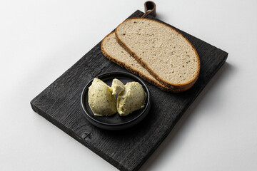 Rye Bread and Herb Butter on Rustic Black Board