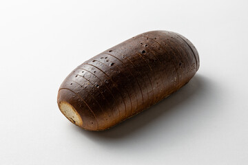 Whole Rye Bread Loaf with Dark Crust on White