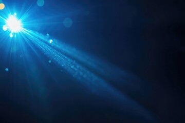 Bright, focused spotlight on stage in front of darkened background. Illuminated area suggests performance space or concert setting.