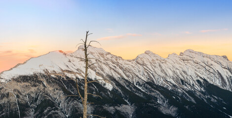 Beautiful snow capped mountains against the twilight sky at Banff National Park in Alberta, Canada.