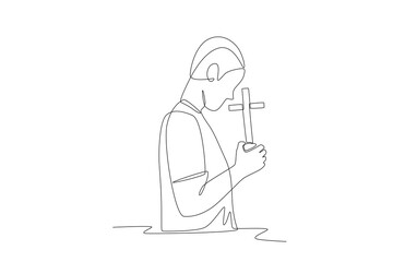 Man praying while holding a cross. Praying concept one-line drawing