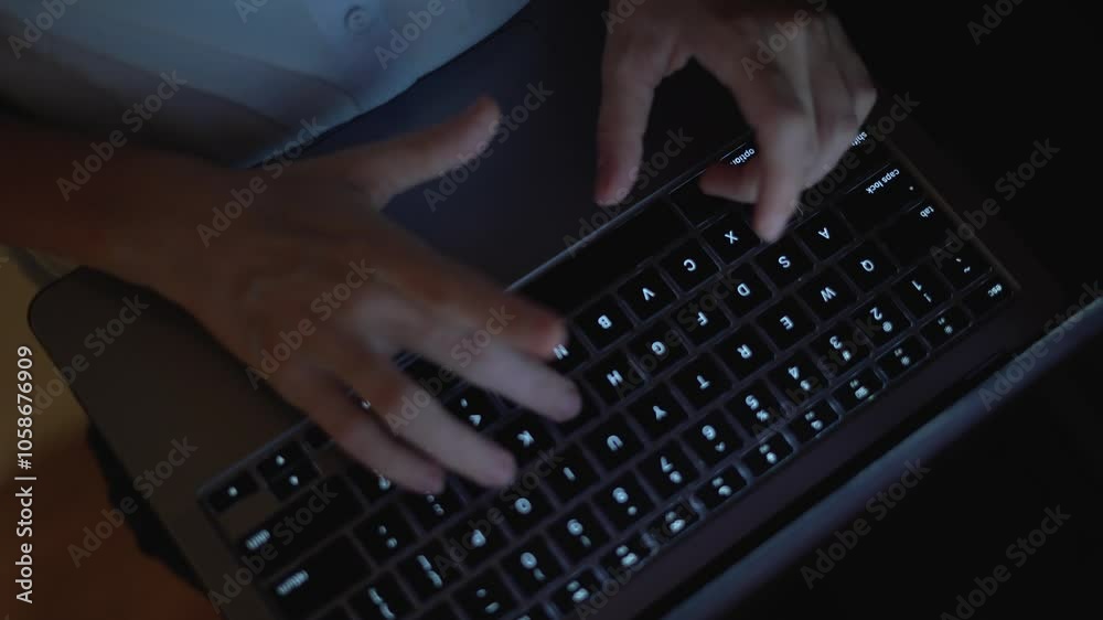 Poster This image features a closeup shot that captures hands actively typing on a laptop keyboard, illuminated by low light, reflecting the essence of modern work, creativity, and professional efficiency
