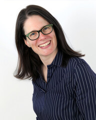 Fototapeta premium Portrait of a woman in a striped jacket and glasses 