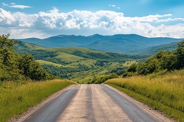 Naklejka premium A Tranquil Dirt Road Meanders Through Lush Green Hills Under a Blue Sky Filled With Fluffy Clouds on a Sunny Day
