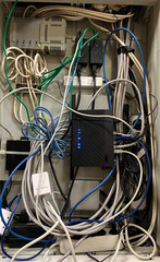 Electrician engineer tests electrical installations and wires on relay protection system. Adjustment of scheme of automation and control of electrical equipment.