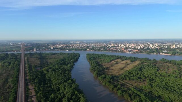 Aerial view of suspension bridge Z&aacute;rate Brazo Largo over Paran&aacute; River with city in background, Argentina