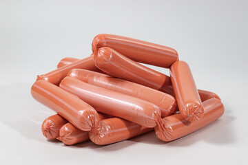 Sausages, semi-finished meat products, salads on a white background