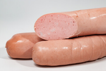 Sausages, semi-finished meat products, salads on a white background