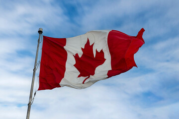Canada flag fluttering on windy day
